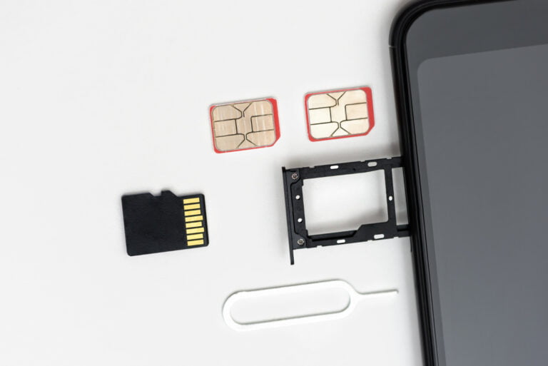 there are sim cards memory card pin near smartphone with open slot